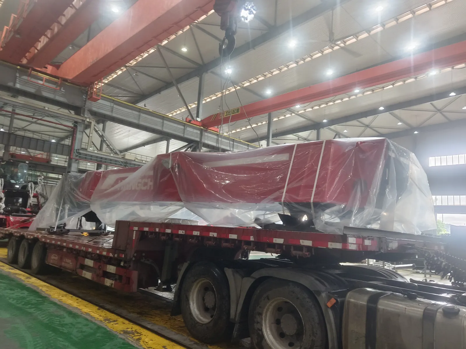 Reach stacker boom secured for project transport