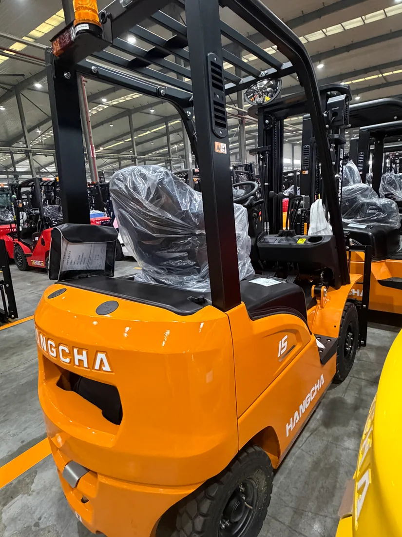 Real compact electric counterbalance forklift chassis detail.