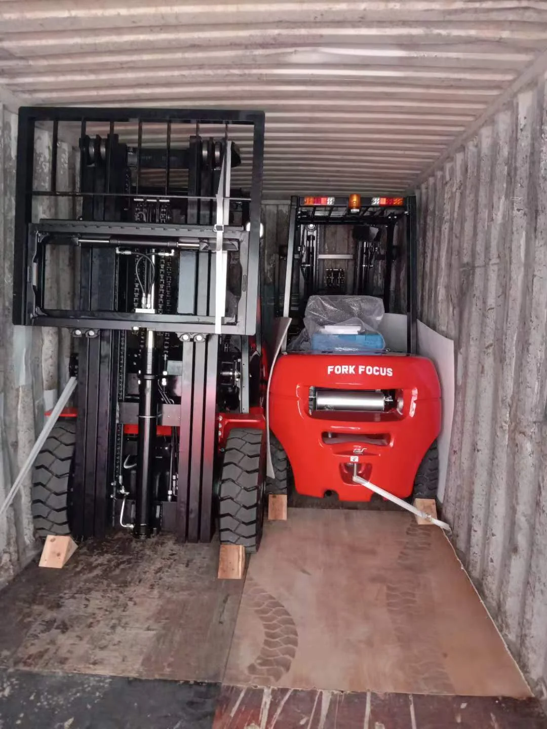 Diesel forklifts positioned inside a 20GP container