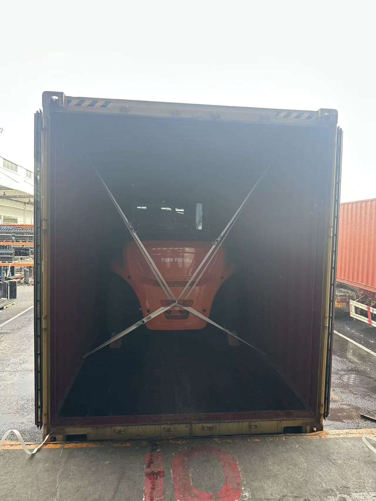 Container loading view with crossed securing lashings