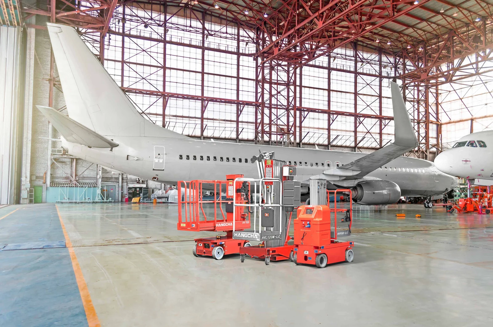 Hangcha self-propelled vertical mast lifts positioned in an aircraft maintenance hangar