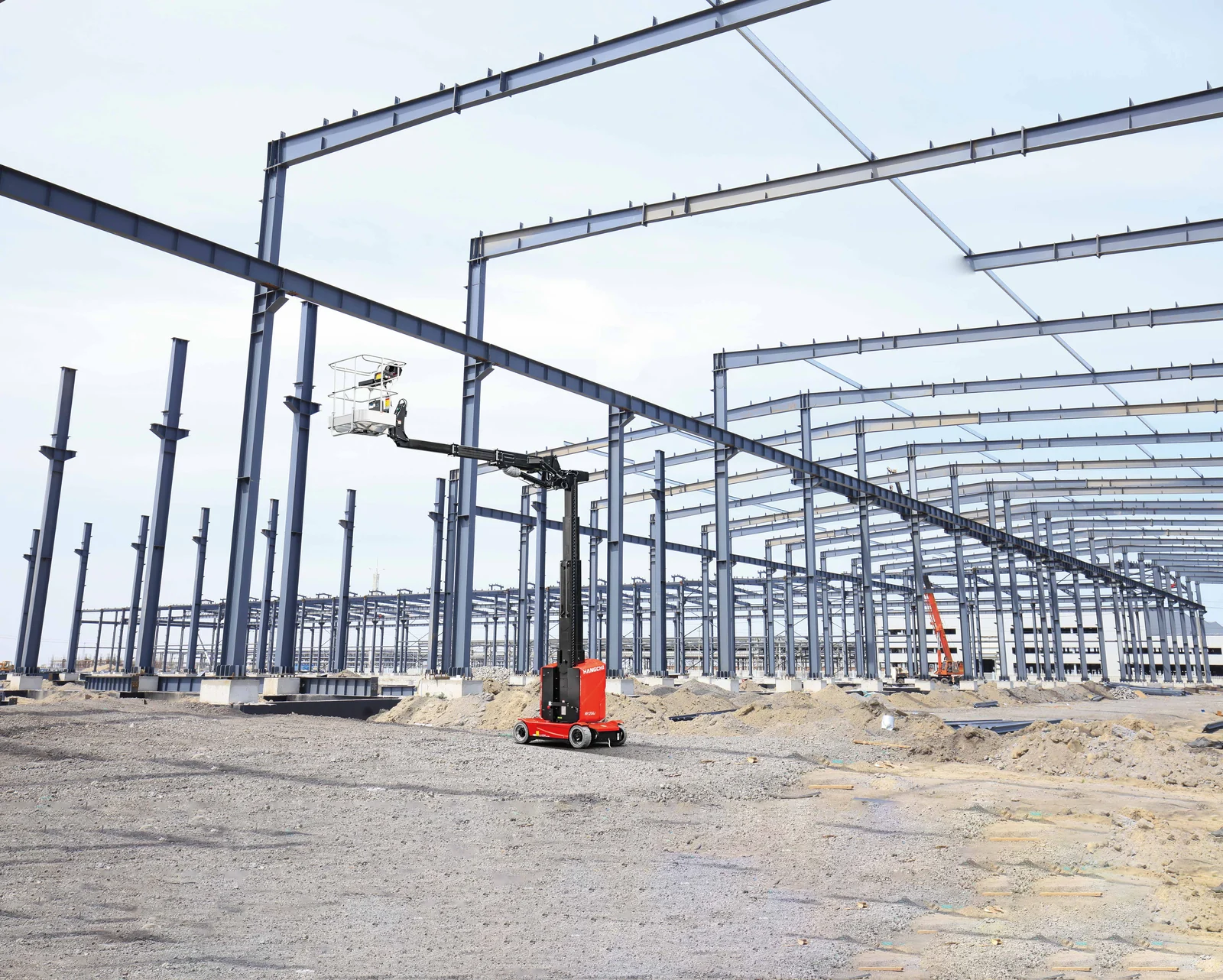 Hangcha HV120AJ vertical mast lift using its jib on an industrial construction site
