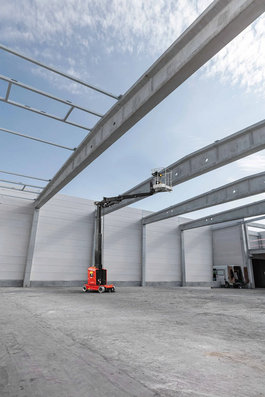 Hangcha HV120AJ vertical mast lift working between structural beams